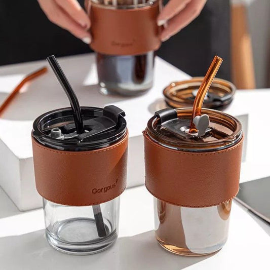 Glass smoothie cup with straw and leather cover